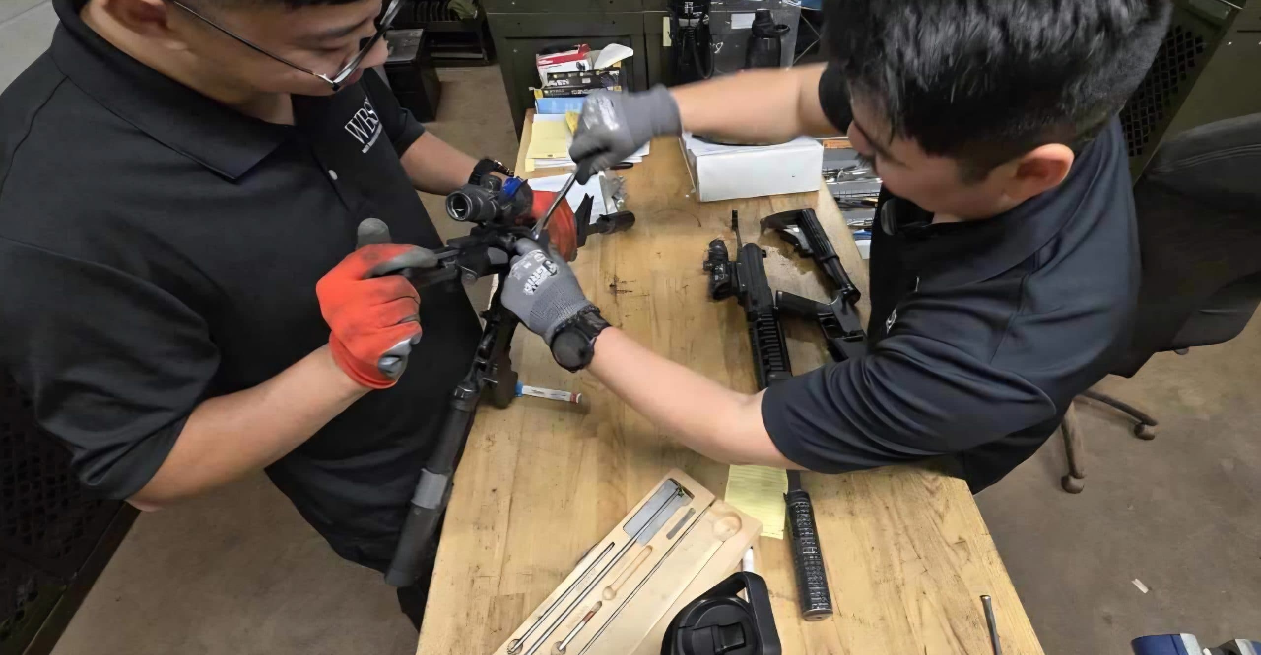 WBSI armorers performing weapons maintenance at the workbench