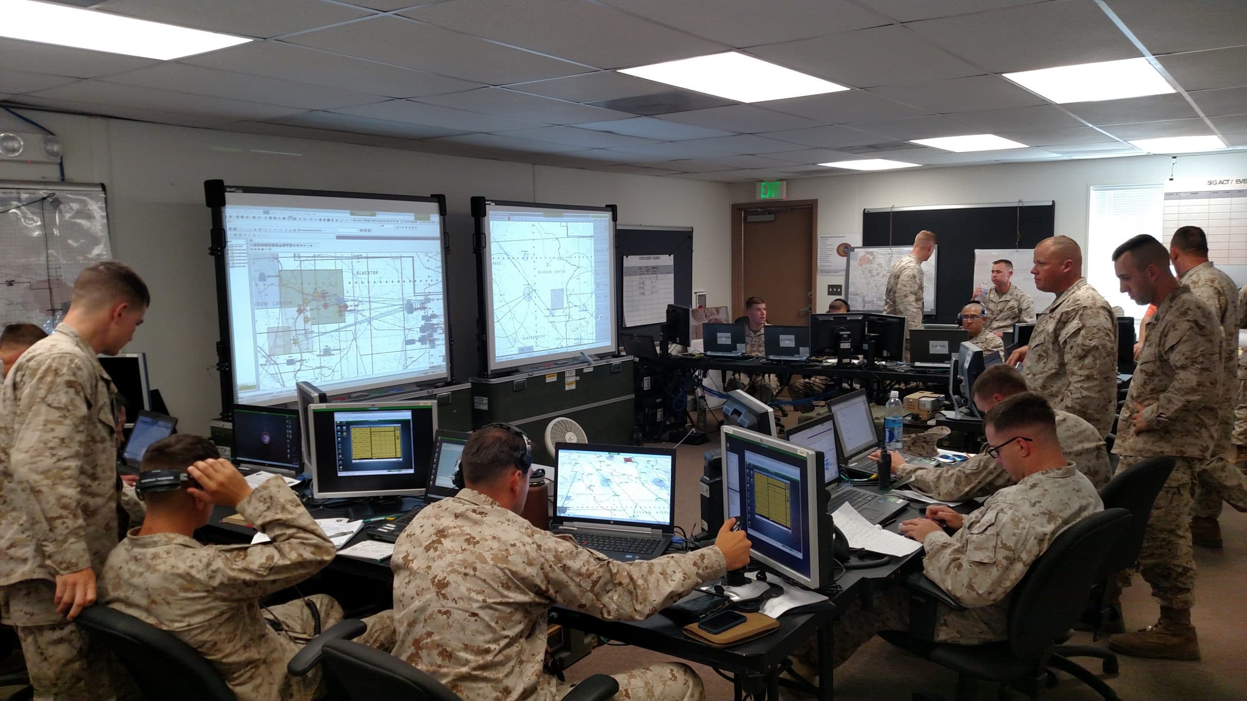 Marines at command and control workstations during a training event